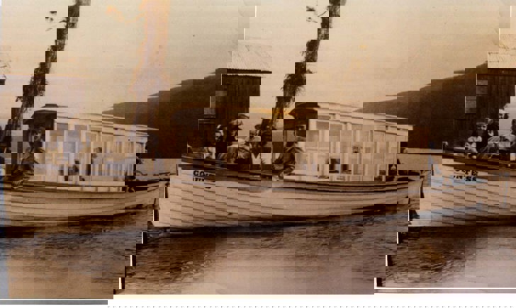 Fred Ross with family and friends aboard the Duchess on Lake Mahinapua